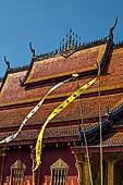 Luang Prabang, Laos - Wat Sene, the sim, the beautiful multi-tiered roof covered with tiles shining under the sun. 